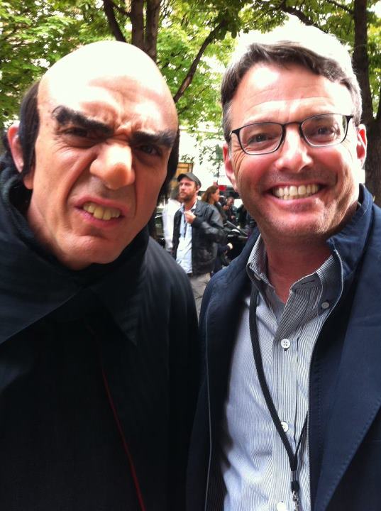  Sony Pictures Digital Productions President Bob Osher with Gargamel (Hank Azaria) in front of the Plaza Athene on the set of The Smurfs 2 in Paris, France.