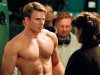 A shirtless Steve Rogers (played by Chris Evans) talks with Peggy Carter (Hayley Atwell). 31179 photo