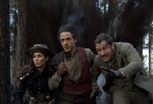 Noomi Rapace as Sim, Robert Downey Jr. as Sherlock Holmes and Jude Law as Dr. Watson in Warner Bros. Pictures’ and Village Roadshow Pictures’ action adventure mystery Sherlock Holmes 2, a Warner Bros. Pictures release. 32948 photo