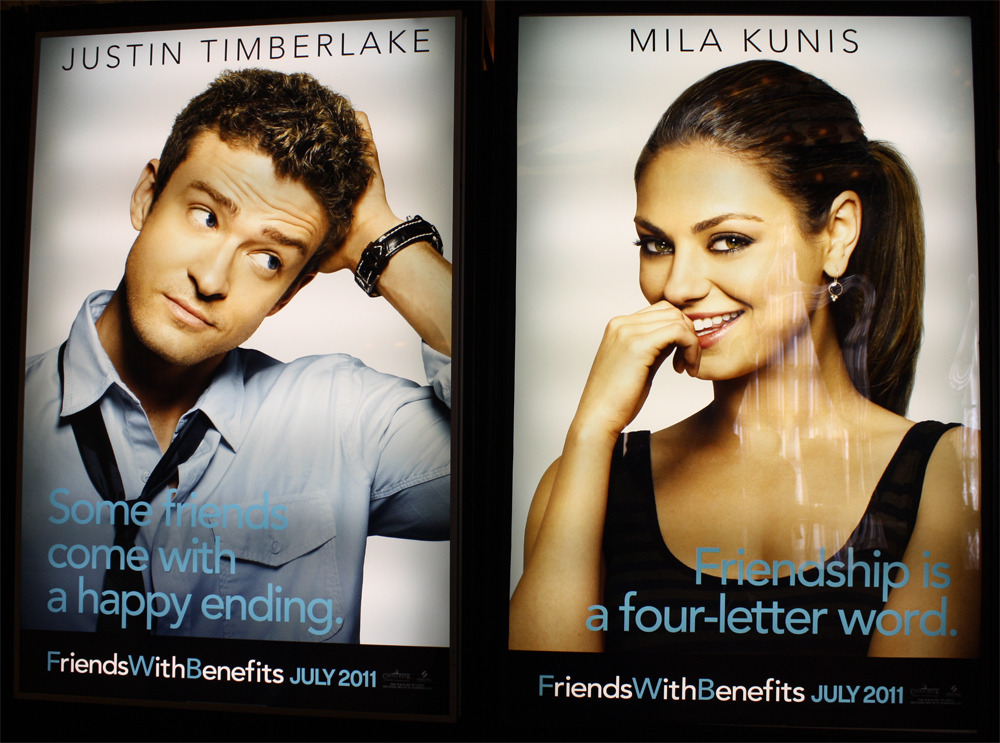  Two FriendsWithBenefits character posters displayed at a cinema.